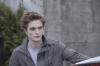 Robert Pattinson as Edward Cullen in "Twilight" behind his car
