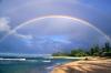 rainbow over land and ocean