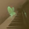 green butterfly on piano